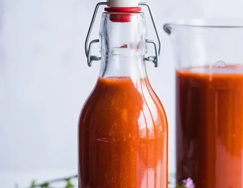 Homemade Fruit Kvass in a Swing-Top Bottle with Fresh Berries